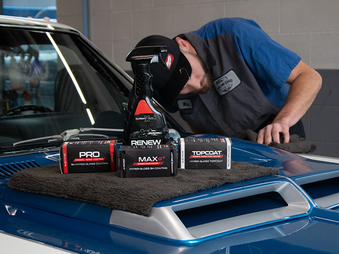 Employee Detailing a Classic Car